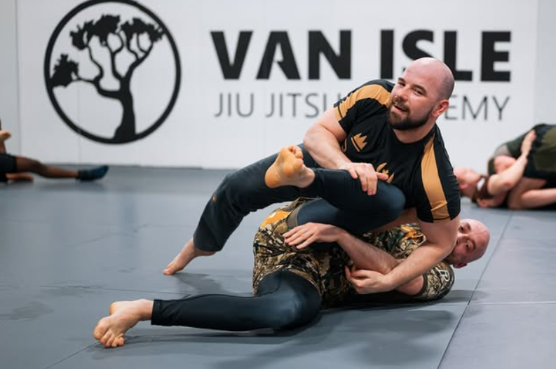 Adult BJJ rolling on the mats